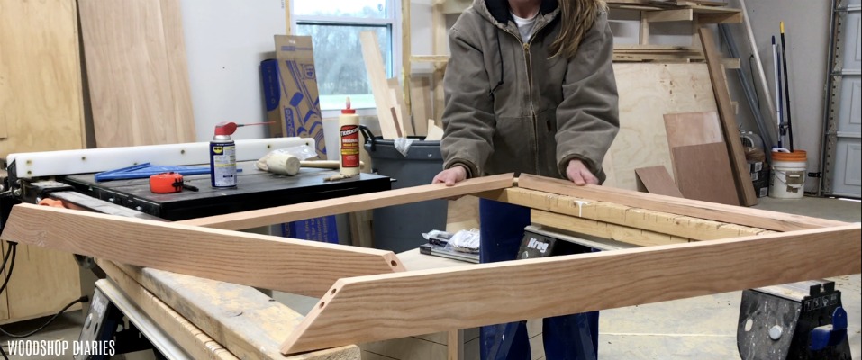 https://www.woodshopdiaries.com/wp-content/uploads/2018/11/Insert-dowels-and-glue-up-corners-of-DIY-picture-Frame.jpg