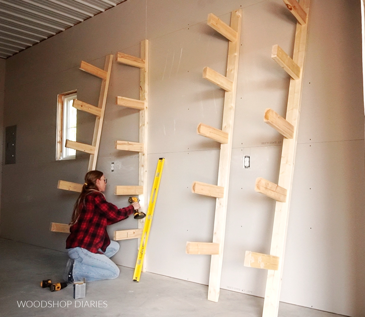 https://www.woodshopdiaries.com/wp-content/uploads/2021/11/screw-lumber-rack-to-studs.jpg