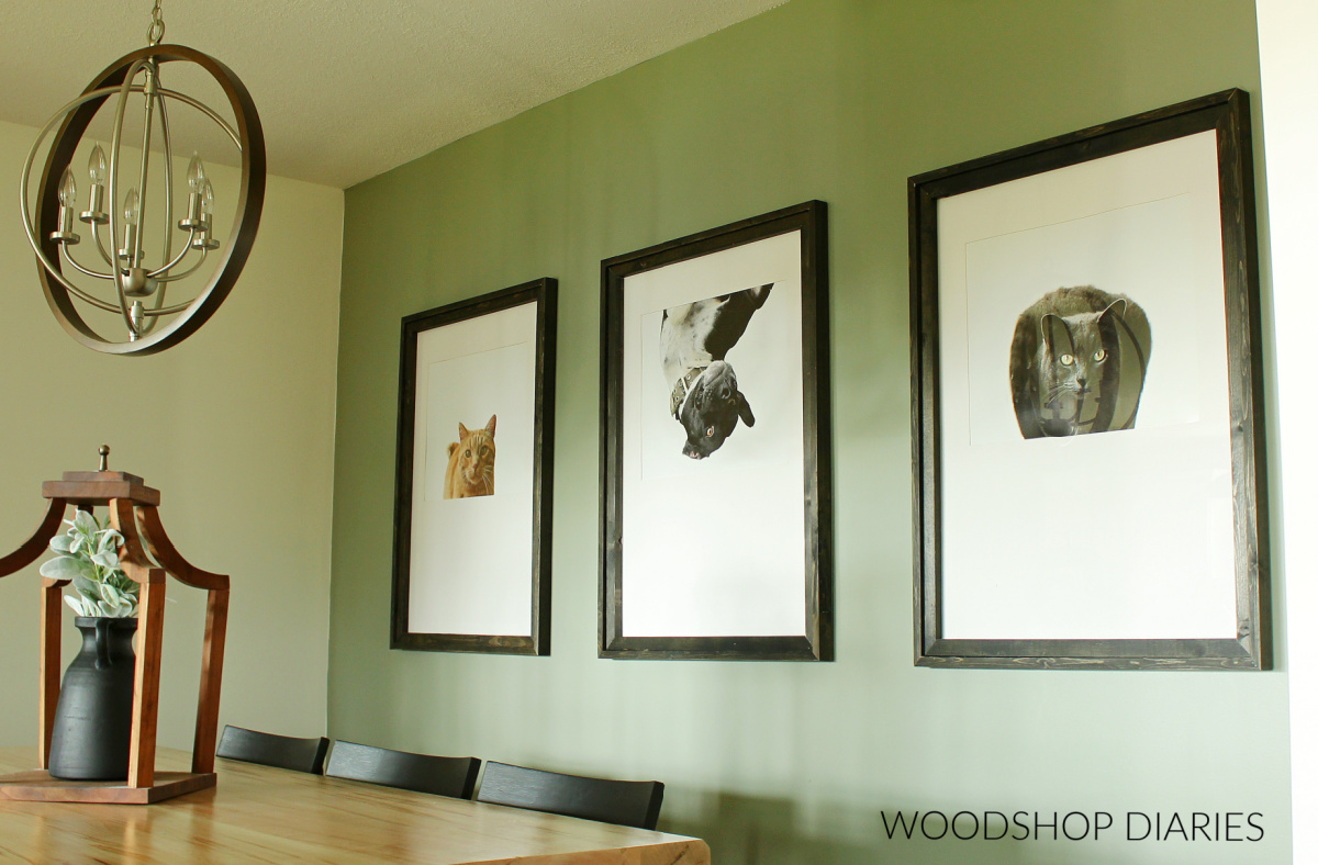 https://www.woodshopdiaries.com/wp-content/uploads/2022/07/Large-custom-framed-photos-on-back-wall.jpg