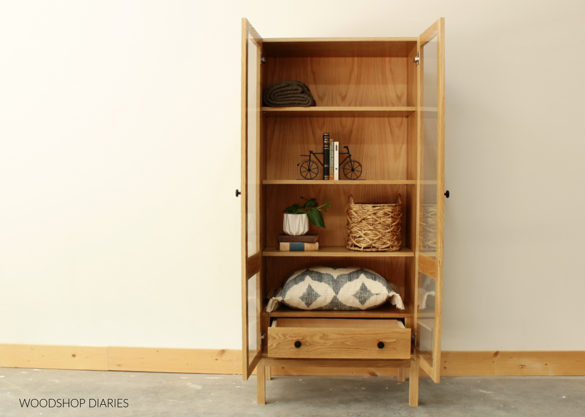 https://www.woodshopdiaries.com/wp-content/uploads/2022/08/DIY-Display-Cabinet-with-doors-and-drawer-open.jpg